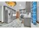 Renovated kitchen showcases modern stainless steel appliances and grey cabinets for a sleek, stylish design at 9082 Chestnut Lake Dr, Jonesboro, GA 30236
