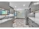 Bright kitchen featuring marble countertops, stainless steel appliances, gray cabinets, and tiled floors at 9082 Chestnut Lake Dr, Jonesboro, GA 30236