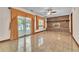 Spacious living room features brick fireplace, ceiling fan, and sliding glass doors at 9082 Chestnut Lake Dr, Jonesboro, GA 30236