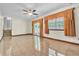 Spacious living room with ceiling fan, sliding glass doors, and view to other room at 9082 Chestnut Lake Dr, Jonesboro, GA 30236