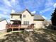 Spacious backyard with a multi-level deck, mature trees and beautiful landscaping at 2585 Chandler Grove Dr, Buford, GA 30519