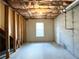 Unfinished basement with a window, insulated ceilings and concrete floor offers ample potential at 2585 Chandler Grove Dr, Buford, GA 30519