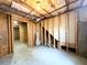Unfinished basement with insulation, concrete floor and stud walls offers ample potential at 2585 Chandler Grove Dr, Buford, GA 30519