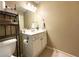 Bathroom with white cabinets and a mirror at 2585 Chandler Grove Dr, Buford, GA 30519