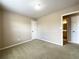 Bedroom with carpet, a closet, and two doors at 2585 Chandler Grove Dr, Buford, GA 30519