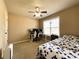 Bedroom with ceiling fan, natural light, and carpeted floors at 2585 Chandler Grove Dr, Buford, GA 30519