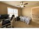 Bedroom featuring ceiling fan, natural light, and neutral walls at 2585 Chandler Grove Dr, Buford, GA 30519