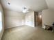 Bright bedroom with carpet flooring, neutral paint, ceiling fan, and closet for ample storage space at 2585 Chandler Grove Dr, Buford, GA 30519