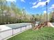 View of the fenced community pool, offering residents a refreshing amenity at 2585 Chandler Grove Dr, Buford, GA 30519