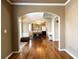 View of the Dining Room with hardwood floors, trim and a large dining table with seating at 2585 Chandler Grove Dr, Buford, GA 30519