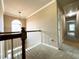 Upstairs hallway with carpet and railing leading to bedrooms at 2585 Chandler Grove Dr, Buford, GA 30519
