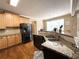 Kitchen with granite countertops, stainless steel appliances, and ample cabinet space at 2585 Chandler Grove Dr, Buford, GA 30519