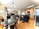 Open kitchen with hardwood floors, island with bar seating, and stainless steel appliances at 2585 Chandler Grove Dr, Buford, GA 30519