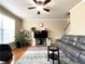 Living room features hardwood floors, fireplace and staircase at 2585 Chandler Grove Dr, Buford, GA 30519