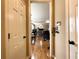 Open-concept living room view showcases the beautiful hardwood floors and access to the kitchen at 2585 Chandler Grove Dr, Buford, GA 30519