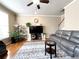 Living room features hardwood floors, fireplace and staircase at 2585 Chandler Grove Dr, Buford, GA 30519