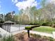 Community pool with lounge, fully fenced in a green space, accessible by sidewalk at 2585 Chandler Grove Dr, Buford, GA 30519