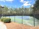 Outdoor tennis courts, enclosed by a fence, offer a space for recreational sports and fitness at 2585 Chandler Grove Dr, Buford, GA 30519