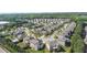 Extensive aerial view of a suburban neighborhood featuring numerous well-kept homes surrounded by lush green trees at 4250 Harrison Lndg, Cumming, GA 30041