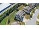 An aerial view showcases a home with a well-manicured lawn, complemented by neighborhood landscaping and a nearby storage facility at 4250 Harrison Lndg, Cumming, GA 30041