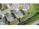 Aerial view of a well-maintained home with a landscaped yard and grey roof at 4250 Harrison Lndg, Cumming, GA 30041