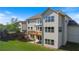 Backyard view of a two-story home featuring a wooden deck on the second floor at 4250 Harrison Lndg, Cumming, GA 30041