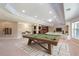 Finished basement featuring a pool table, living room, and bar at 4250 Harrison Lndg, Cumming, GA 30041