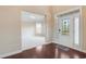 Inviting entryway features a decorative glass door and hardwood floors leading into the carpeted living space at 4250 Harrison Lndg, Cumming, GA 30041