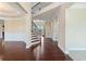 Elegant foyer with hardwood floors, a staircase leading to the second floor, and paneled walls at 4250 Harrison Lndg, Cumming, GA 30041