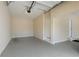 Garage with an epoxy floor, garage door opener, and entry door to interior at 4250 Harrison Lndg, Cumming, GA 30041