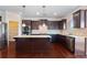 Gourmet kitchen featuring a center island, stainless steel appliances and plenty of cabinet space for storage at 4250 Harrison Lndg, Cumming, GA 30041
