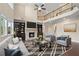 Inviting living room with a cozy fireplace, built-in bookshelves and large windows with lots of natural light at 4250 Harrison Lndg, Cumming, GA 30041