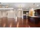 Open floor plan with seamless transition from the kitchen to the living area with hardwood floors throughout at 4250 Harrison Lndg, Cumming, GA 30041