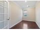 Home office with French doors, hardwood floors, a window with blinds, and neutral paint at 4250 Harrison Lndg, Cumming, GA 30041