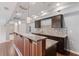 Basement wet bar area with granite counters, tiled backsplash, custom cabinets, and pendant lighting at 4250 Harrison Lndg, Cumming, GA 30041
