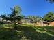 Spacious backyard featuring a large lawn, storage shed, and patio area at 6010 Silver Lace Nw Ln, Acworth, GA 30101