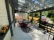Covered patio features an outdoor dining area and grill, perfect for backyard gatherings at 6010 Silver Lace Nw Ln, Acworth, GA 30101