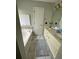 Bathroom boasts a dual sink vanity, separate tub, and mosaic tile accent at 6010 Silver Lace Nw Ln, Acworth, GA 30101