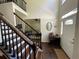 Bright foyer featuring hardwood floors, a staircase, and views into adjacent living spaces at 6010 Silver Lace Nw Ln, Acworth, GA 30101