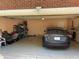 Spacious garage with a Tesla parked inside and visible storage shelves at 6010 Silver Lace Nw Ln, Acworth, GA 30101