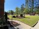 Professionally landscaped yard with manicured lawn, shrubs, and flowering plants at 6010 Silver Lace Nw Ln, Acworth, GA 30101