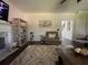 Inviting living room with a fireplace, decorative rug, and comfortable armchair, perfect for relaxation at 6010 Silver Lace Nw Ln, Acworth, GA 30101