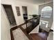 Bright staircase with dark wood floors leading to the front door at 6010 Silver Lace Nw Ln, Acworth, GA 30101