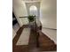 Beautiful staircase with dark wood floors and a large window bringing in natural light at 6010 Silver Lace Nw Ln, Acworth, GA 30101