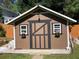 Charming storage shed with painted trim and flower boxes at 6010 Silver Lace Nw Ln, Acworth, GA 30101