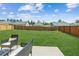 Large, fenced-in backyard with a patio area, ideal for entertaining at 814 Lakehaven Ln, Loganville, GA 30052