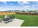 Expansive backyard features a lush lawn, a patio with outdoor furniture, and a wood fence for privacy at 814 Lakehaven Ln, Loganville, GA 30052