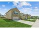Two-story house with brick and siding exterior, an attached garage and a green lawn at 814 Lakehaven Ln, Loganville, GA 30052