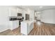 Elegant kitchen with white cabinets, stainless steel appliances, and a center island at 814 Lakehaven Ln, Loganville, GA 30052