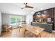 Dining room showcases a long wood table, accent wall, and buffet counter with stylish decor at 8175 Main St, Woodstock, GA 30188